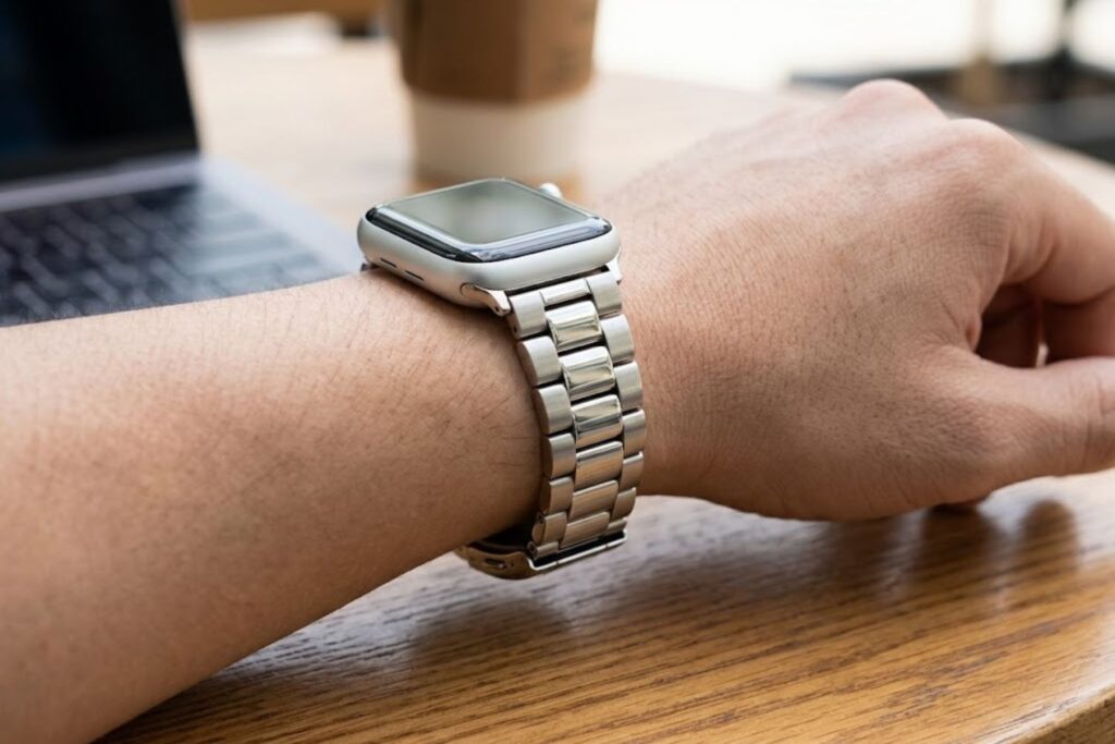 Posh Tech Emery silver stainless steel Apple Watch band on wrist