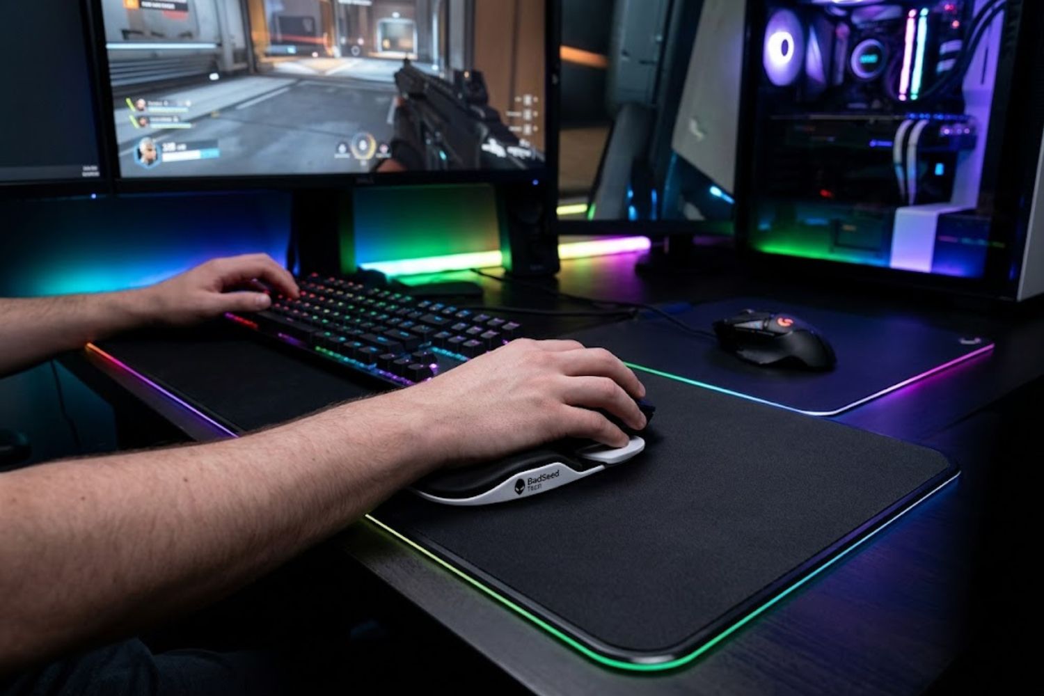 BadSeed Tech Carpio 2.0 gliding wrist rest on dark gaming desk with RGB setup