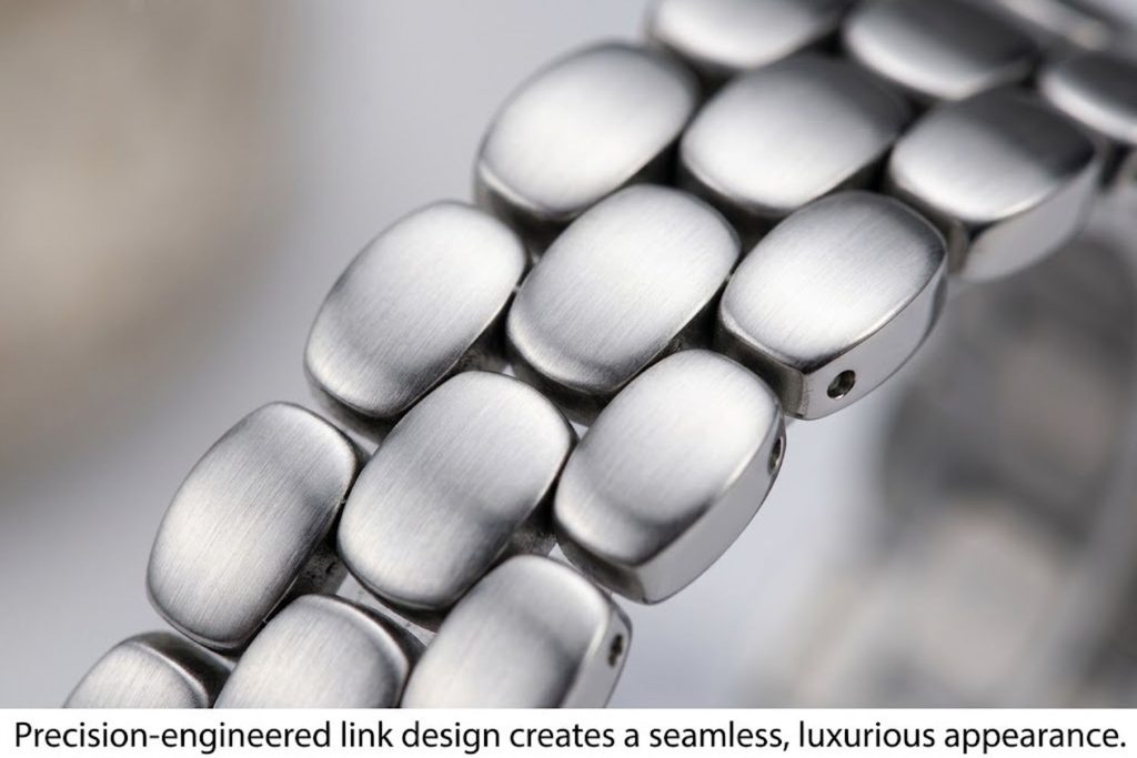 Macro close-up of Posh Tech Emery band links showing precision manufacturing, anti-scratch finish, and seamless connection points