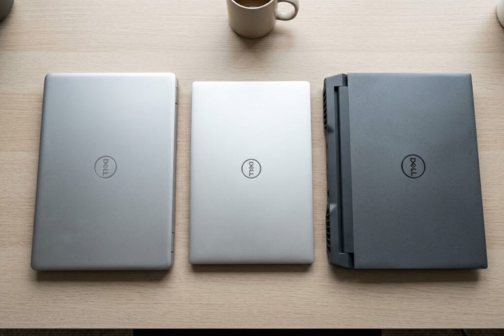 Three Dell laptop models compared side-by-side: budget Inspiron, premium XPS, and gaming G-Series showing design and size differences